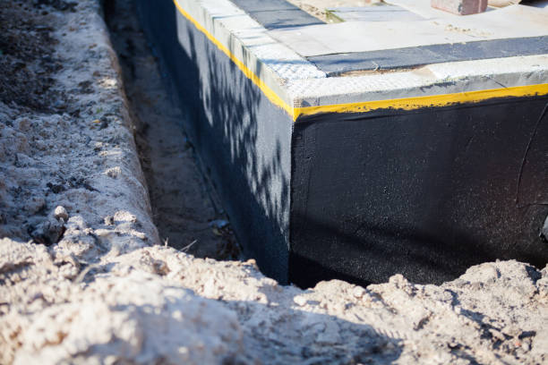Professional Waterproofing technician working in Locust Valley, NY